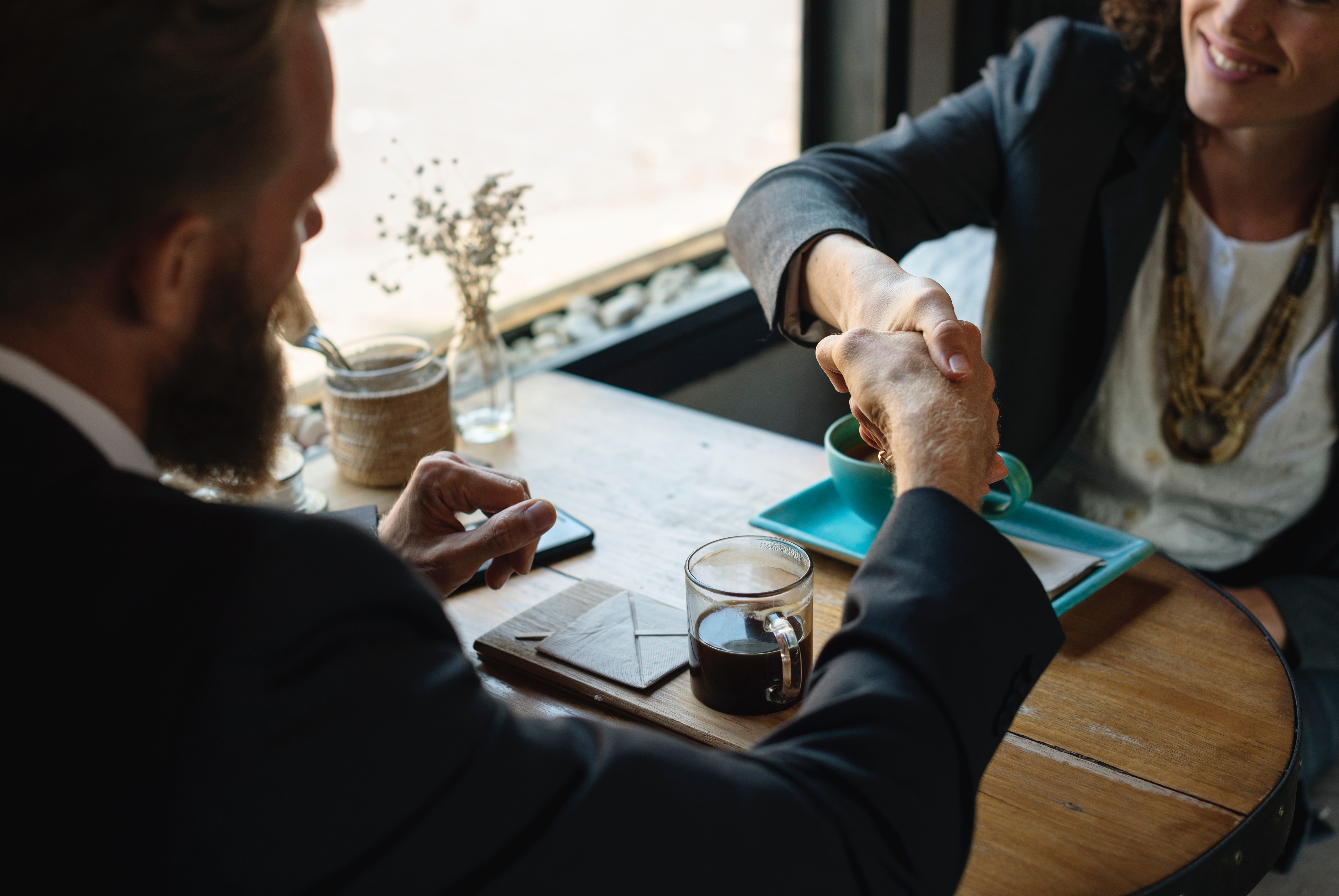 Hand shake and coffee